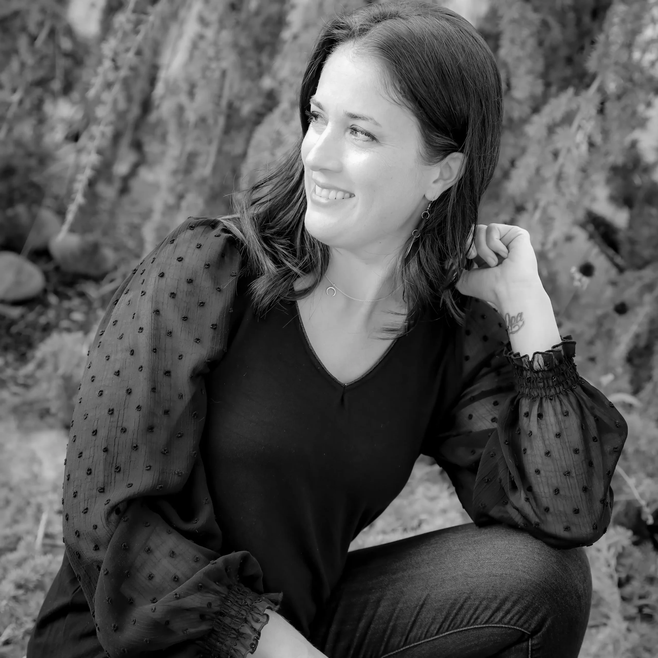 Beth Reid sitting monochromatic black white